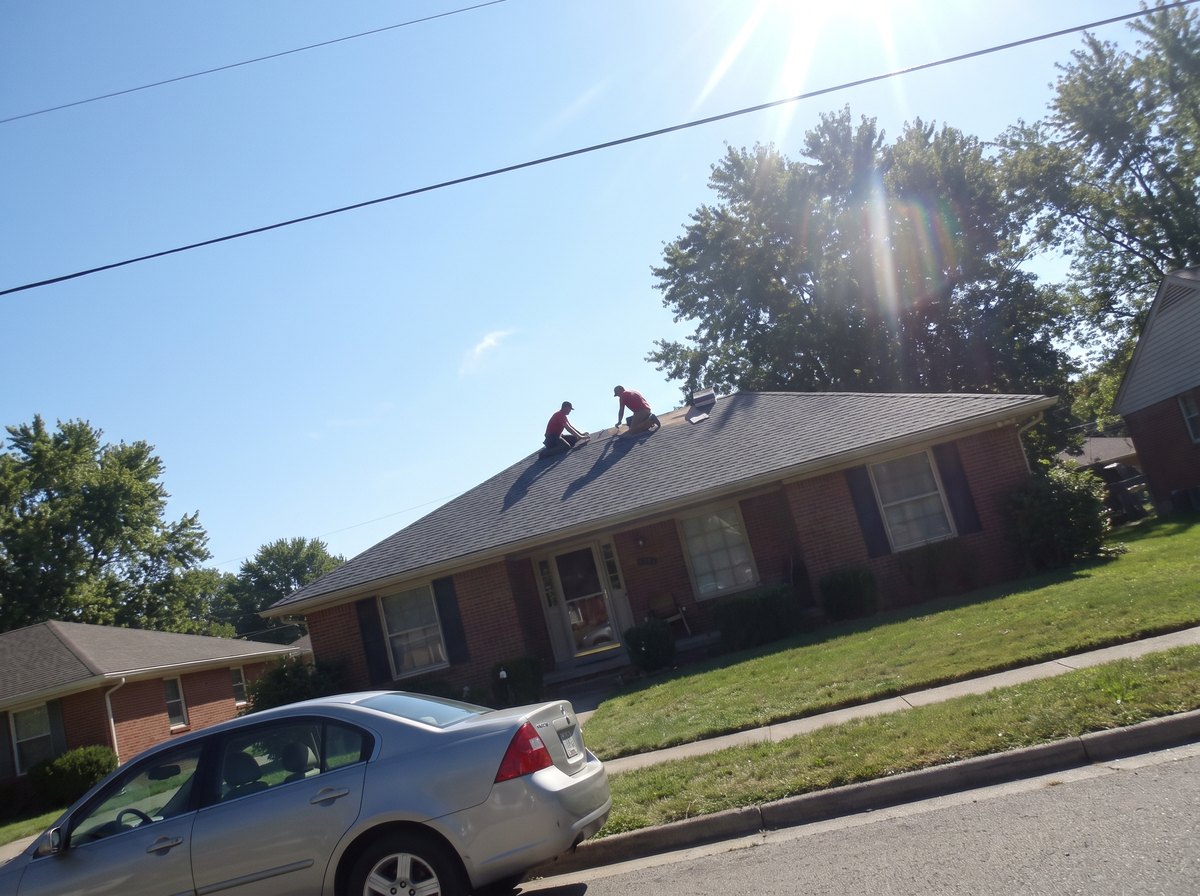 A crew photo from a job two streets over: the right street, shot into the sun.