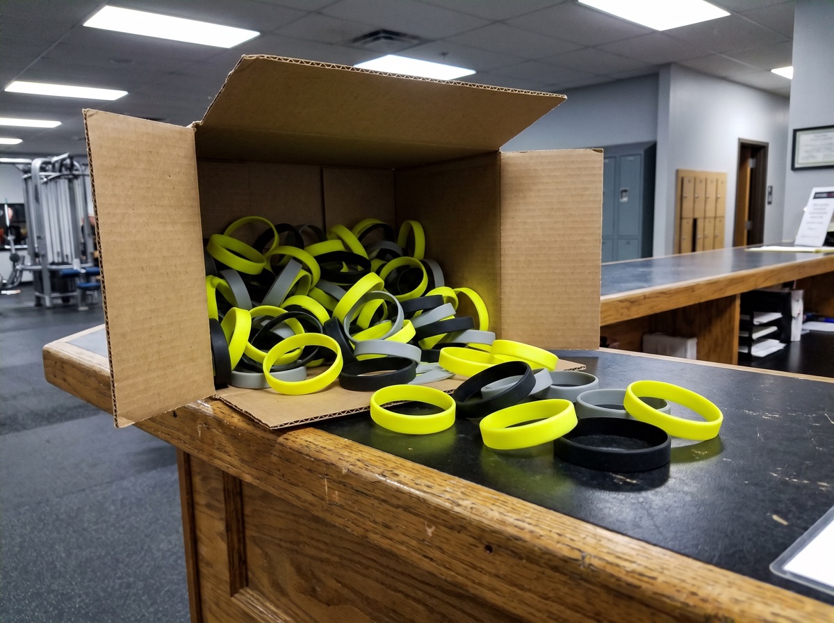 Last year’s team wristbands, most of them never handed out.