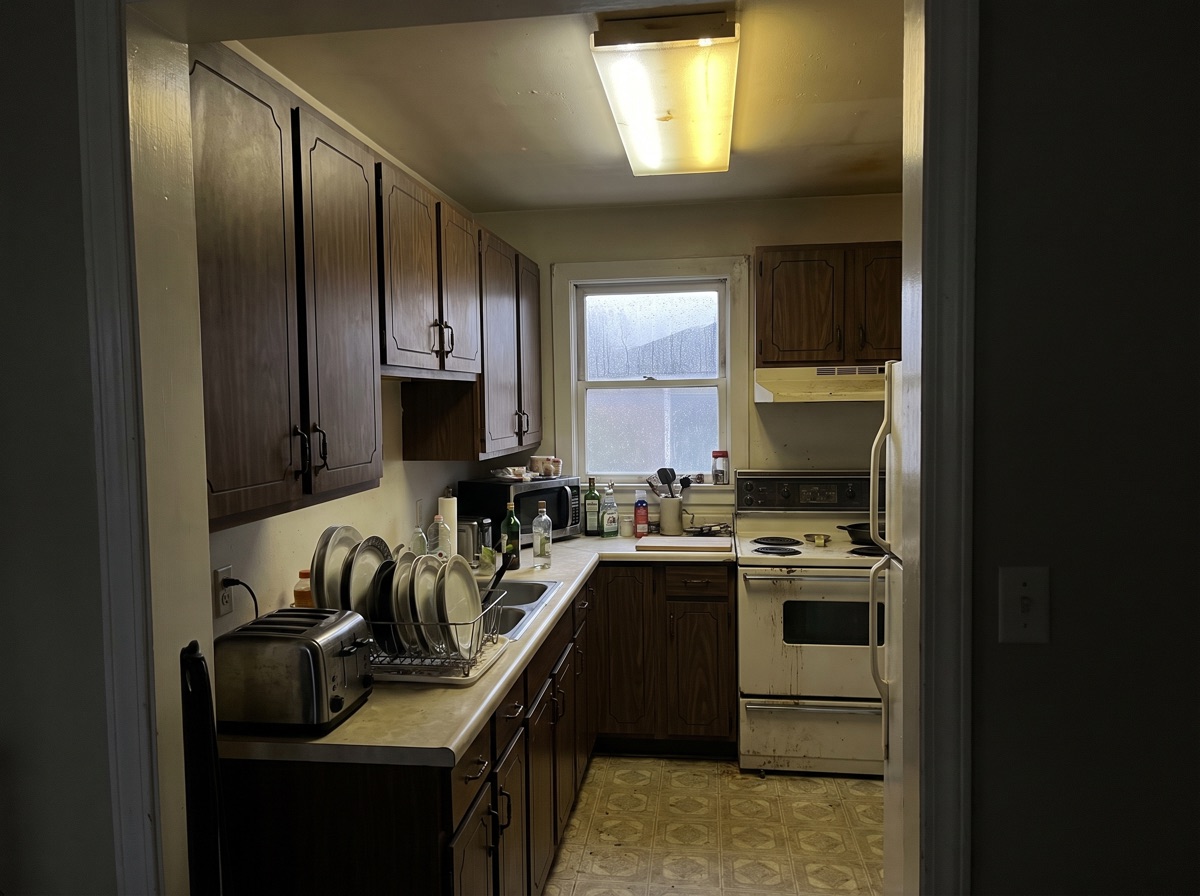 The Sellwood kitchen at the first design visit, from the dining-room doorway.